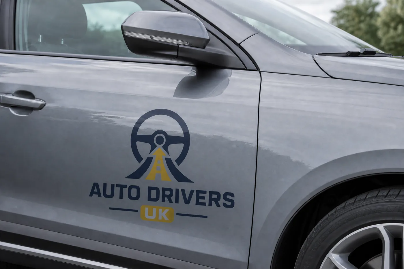 Close-up of Auto Drivers UK door branding